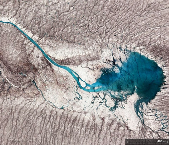 Supraglacial hydrology. Blue-coloured Greenland supraglacial lake on top of the Greenland Ice Sheet. 